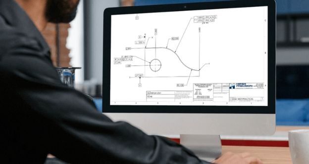 Design engineer reviews GD&T callouts on a part drawing